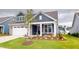 Two-story home with stone and siding exterior, large garage, well-manicured lawn and landscaping at 1720 Pinecliff Ct, Fuquay Varina, NC 27526