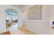 Bright foyer with archway, decorative wall art, and hardwood floors leading to living area at 1720 Pinecliff Ct, Fuquay Varina, NC 27526