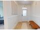 Bright entryway with light wood flooring, decorative wall art, and white front door at 1720 Pinecliff Ct, Fuquay Varina, NC 27526