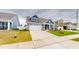 Charming home featuring stone accents, a two-car garage, and well-manicured landscaping at 1720 Pinecliff Ct, Fuquay Varina, NC 27526