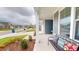 Relaxing front porch with comfortable seating and a view of the neighborhood at 1720 Pinecliff Ct, Fuquay Varina, NC 27526