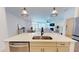 Modern kitchen features stainless steel appliances and flows into an open floor plan at 1720 Pinecliff Ct, Fuquay Varina, NC 27526