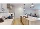 Modern kitchen features stainless steel appliances and flows into an open floor plan at 1720 Pinecliff Ct, Fuquay Varina, NC 27526