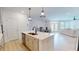 Open-concept kitchen with stainless appliances flows into dining and living area, great for entertaining at 1720 Pinecliff Ct, Fuquay Varina, NC 27526