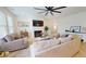 Bright living room featuring a fireplace, recessed lighting, and an open concept design leading to additional living spaces at 1720 Pinecliff Ct, Fuquay Varina, NC 27526