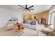 Bright living room featuring modern decor, neutral tones, and an open concept design leading to kitchen and dining areas at 1720 Pinecliff Ct, Fuquay Varina, NC 27526