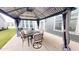 Outdoor dining area under a gazebo features a dining set and lighting for evening enjoyment at 1720 Pinecliff Ct, Fuquay Varina, NC 27526