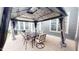 Back patio with covered gazebo containing an outdoor dining set; an ideal entertaining space at 1720 Pinecliff Ct, Fuquay Varina, NC 27526