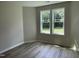 Bright bedroom with ample natural light and stylish vinyl plank flooring at 176 Bonsai Way, Four Oaks, NC 27524