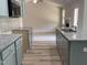 Well-equipped kitchen with stylish granite countertops and seamless view into the living room at 176 Bonsai Way, Four Oaks, NC 27524