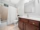 Charming bathroom with tile flooring, modern fixtures, and a shower and tub combination at 1825 Watkins St, Raleigh, NC 27604