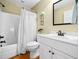 Functional bathroom featuring a shower and tub combination and bright lighting at 1825 Watkins St, Raleigh, NC 27604