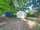 Exterior shed with double door, perfect for extra storage at 1825 Watkins St, Raleigh, NC 27604