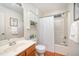 Well-lit bathroom with a shower-tub combo, vanity, and storage cabinet at 1851 Trailwood Heights Ln # 204, Raleigh, NC 27603