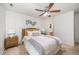 This bedroom features carpet floors, modern decor, a ceiling fan, and an attached bathroom at 1851 Trailwood Heights Ln # 204, Raleigh, NC 27603