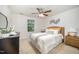 Bright bedroom with a ceiling fan, carpeted floors and natural light from the window at 1851 Trailwood Heights Ln # 204, Raleigh, NC 27603