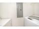 Well-lit laundry area featuring modern appliances and ample space at 1851 Trailwood Heights Ln # 204, Raleigh, NC 27603