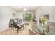 Bright and airy living room with a sliding door to the balcony and an open view into the bedroom at 1851 Trailwood Heights Ln # 204, Raleigh, NC 27603