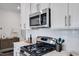 Elegant kitchen features stainless steel appliances, tile backsplash, and gas cooktop at 2010 Nebula Way, Durham, NC 27703