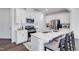 Well-lit kitchen features stainless steel appliances and an island with seating at 2010 Nebula Way, Durham, NC 27703