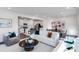 Bright living room with modern furnishings open to kitchen and dining area at 2010 Nebula Way, Durham, NC 27703