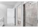 Bathroom featuring tiled shower, toilet, and access to an additional room at 2019 Nebula Way, Durham, NC 27703