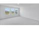 Bright, airy bedroom with large windows and plush carpeting; a peaceful retreat at 2019 Nebula Way, Durham, NC 27703
