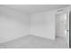 Bedroom with light gray carpet, white walls, and a view of a hallway at 2019 Nebula Way, Durham, NC 27703