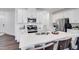 Bright kitchen with stainless steel appliances, ample cabinets, and a large center island at 2019 Nebula Way, Durham, NC 27703