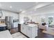 Open kitchen featuring stainless appliances, a central island, and views to the living area at 2019 Nebula Way, Durham, NC 27703