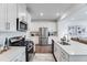 Modern kitchen featuring stainless steel appliances, white cabinets, and ample counter space for cooking at 2019 Nebula Way, Durham, NC 27703