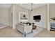 Cozy living room with modern lighting, comfortable seating, and adjacent entertainment area at 2110 Kettle Falls Sta # 687, Apex, NC 27502