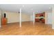 Spacious basement with hardwood floors, kitchen area, and large open space at 2139 Race Track Rd, Burlington, NC 27215