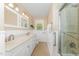 Bright bathroom with double sinks and a glass-enclosed shower at 2139 Race Track Rd, Burlington, NC 27215