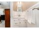 Cozy bathroom with modern vanity and white wainscoting at 2139 Race Track Rd, Burlington, NC 27215