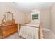Comfortable bedroom with neutral tones and natural lighting at 2139 Race Track Rd, Burlington, NC 27215