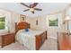 Bedroom featuring a wooden bed frame, ceiling fan, and natural light at 2139 Race Track Rd, Burlington, NC 27215