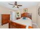 Bedroom with a full bed, ceiling fan, and connecting bathroom at 2139 Race Track Rd, Burlington, NC 27215