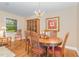 Traditional dining area with wood table, ornate hutch, and elegant chandelier at 2139 Race Track Rd, Burlington, NC 27215