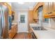 Well-equipped kitchen boasting oak cabinetry, stainless steel appliances, and ample counter space at 2139 Race Track Rd, Burlington, NC 27215