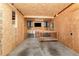Garage work area with wooden work bench, mounted cabinets, and TV at 2139 Race Track Rd, Burlington, NC 27215