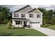 Charming two-story home with gray accents, a covered porch, and a two-car garage at 228 Sprenger St, Garner, NC 27529