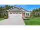 Beautiful home with a two-car garage, stone accents, and a well-manicured lawn at 28 Elmwood Ave, Sanford, NC 27330