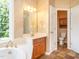 Bathroom featuring wood cabinets, tile floor, toilet, and separate water closet at 2819 Russell Mcpherson Rd, Burlington, NC 27215