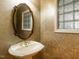 Powder room with custom mirror, pedestal sink, and decorative glass block window at 2819 Russell Mcpherson Rd, Burlington, NC 27215