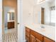Bathroom featuring a large vanity mirror, wood cabinets and tile floors at 2819 Russell Mcpherson Rd, Burlington, NC 27215