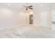 Spacious bedroom with neutral carpet, ceiling fan, and ample natural light at 2819 Russell Mcpherson Rd, Burlington, NC 27215