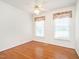 Comfortable bedroom with hardwood floors, window, and a ceiling fan at 2819 Russell Mcpherson Rd, Burlington, NC 27215
