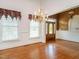 Inviting entryway featuring hardwood floors, large windows, and an elegant chandelier at 2819 Russell Mcpherson Rd, Burlington, NC 27215