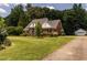 Traditional brick home with an attached garage and a neatly maintained lawn at 2819 Russell Mcpherson Rd, Burlington, NC 27215